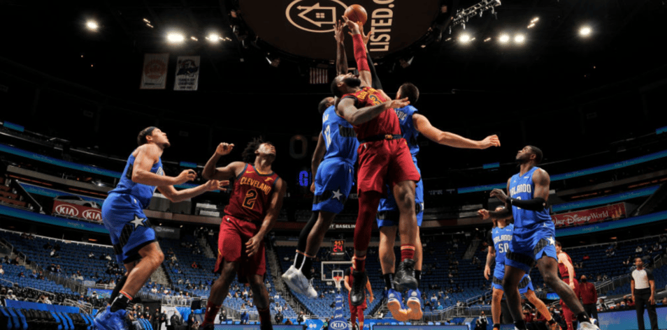 Basketball players in arena. Blocked shot